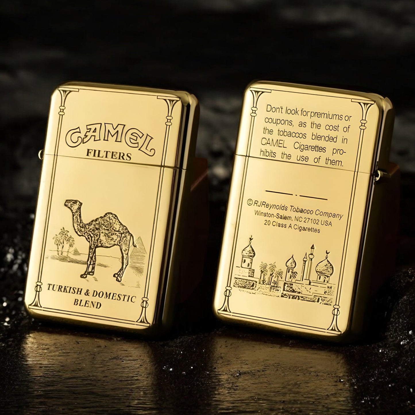 two golden camel engraved lighters