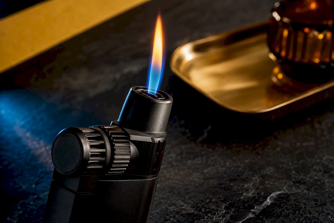 Torch lighter flame adjusted to safe height