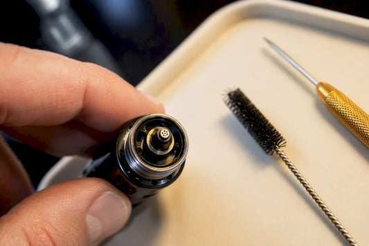 Inspecting a clogged torch lighter burner jet