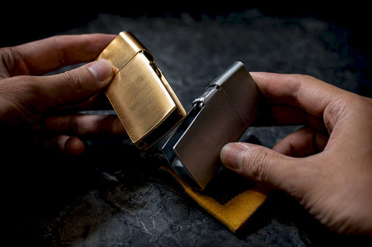 Hands comparing premium lighter shell materials