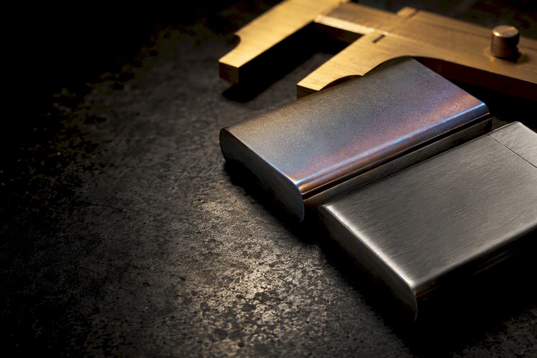 Cropped titanium and stainless lighter case edges