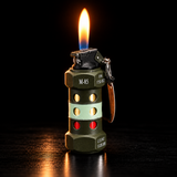 A miniature military-style lighter shaped like a stun grenade, lit with a bright flame — view 2