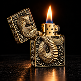 An ornate gold-toned lighter with a raised dragon design on the front and a flame lit, photographed against a dark black background. — view 4