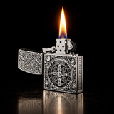 An ornate silver metal lighter with intricate engraved patterns and a circular crest on the front and flame — view 2