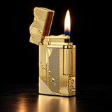A gold lighter with intricate geometric and wave patterns, shown open with a lit flame against a solid black background. — view 1